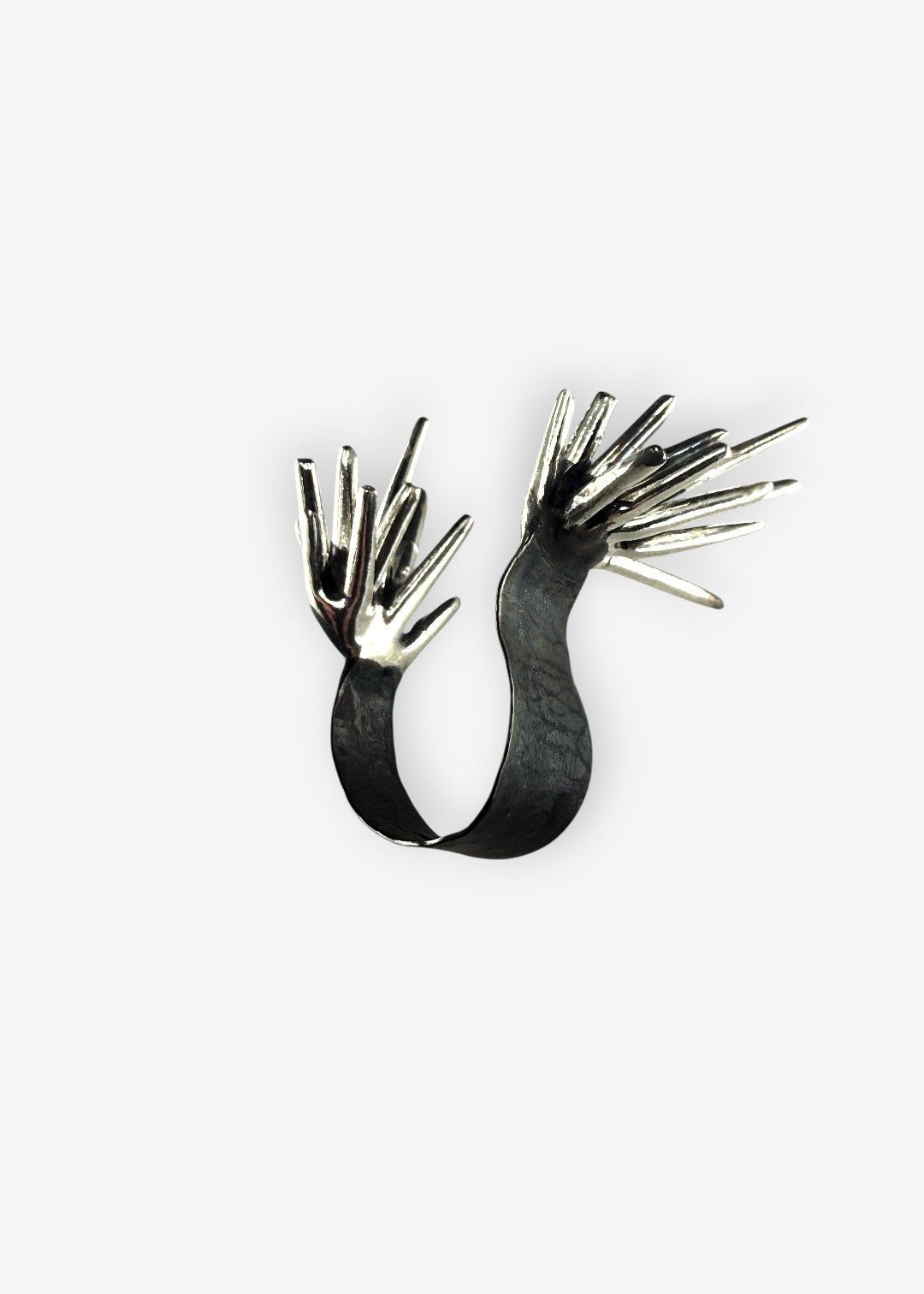 Sterling silver Beam Apart ring with opposing spike structures open design front view on white background