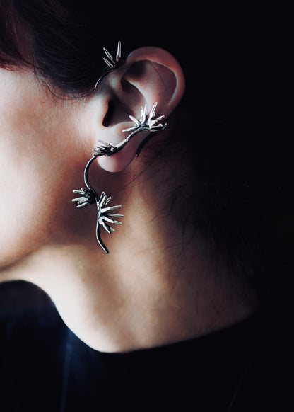 Sterling silver sculptural ear cuff with branching spike design worn on ear Beam Collection statement ear jewelry no piercing