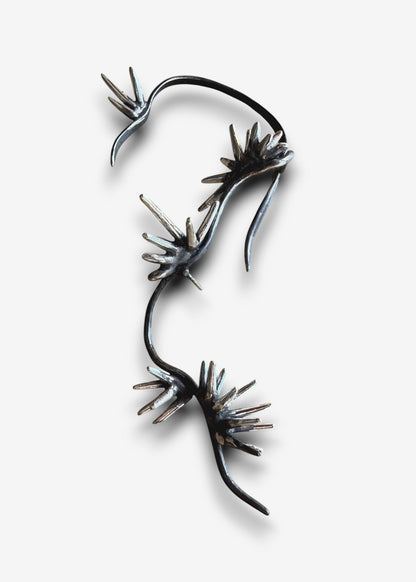 Sterling silver sculptural ear cuff with branching spike design Beam Collection left ear cuff isolated on white background