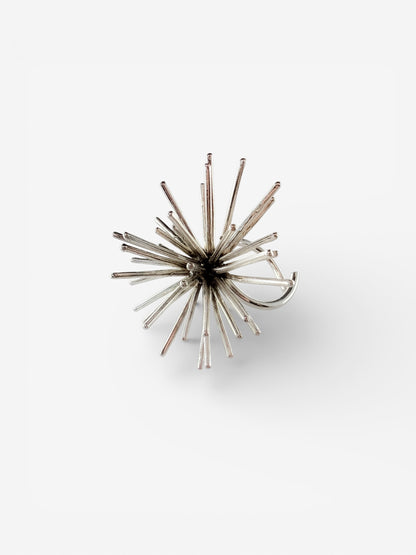 Handmade sterling silver Beam ring by Ninimosi, sculptural spike design with adjustable band on white background