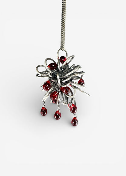 Sterling silver Inversion necklace pendant with dense folded beam structure and multiple dangling red Czech glass drops on chain