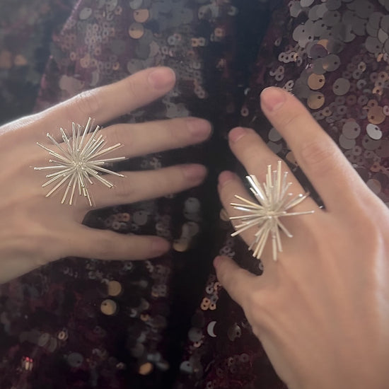 Handmade sterling silver Beam ring by Ninimosi, sculptural spike design shown up close on hand