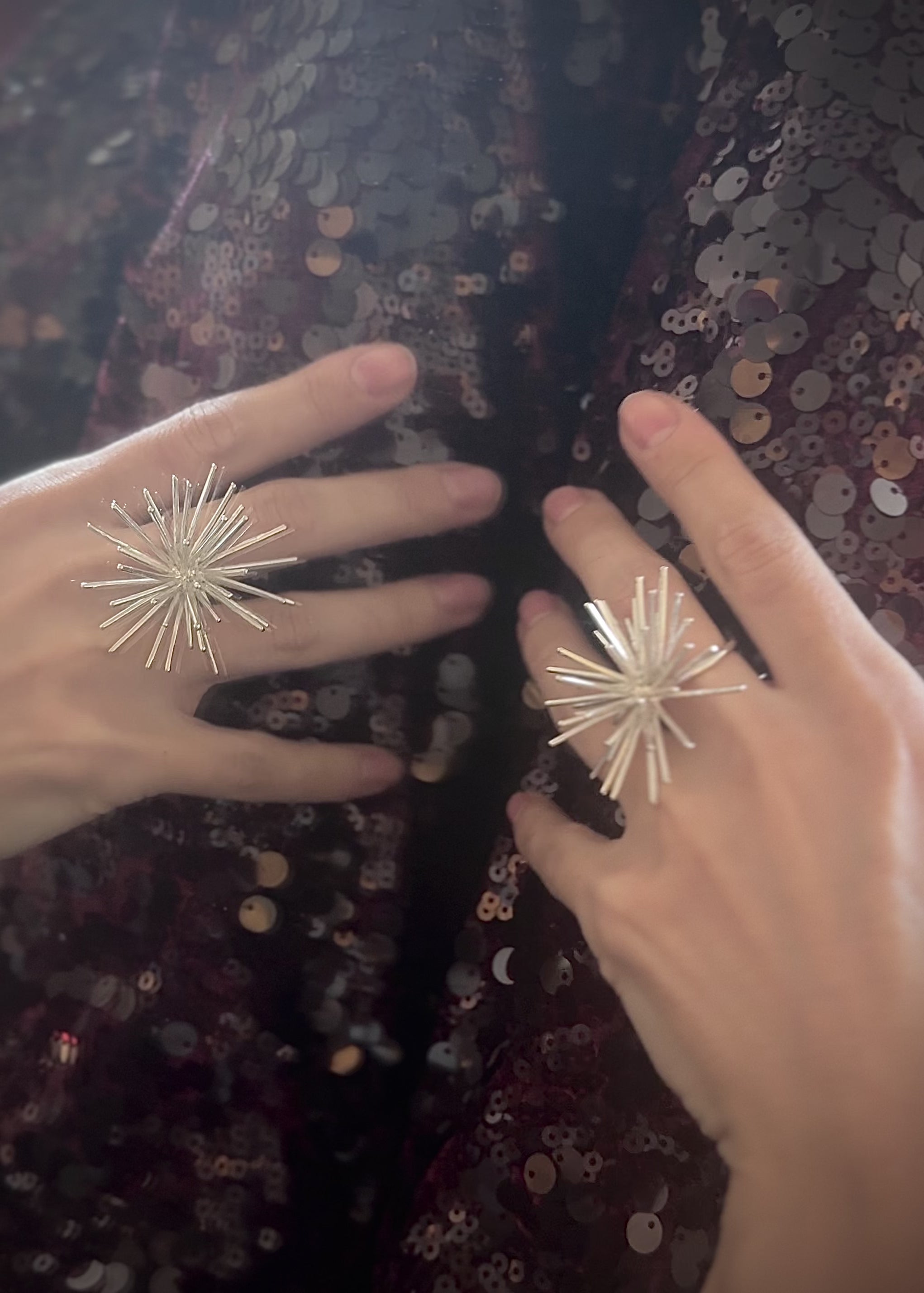 Handmade sterling silver Beam ring by Ninimosi, sculptural spike design shown up close on hand